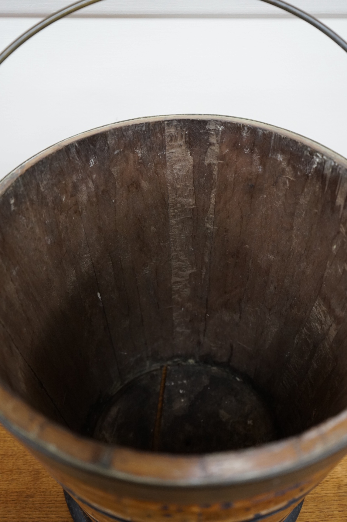A 19th century Dutch oyster bucket with swing handle, 31cm high. Condition - some splits